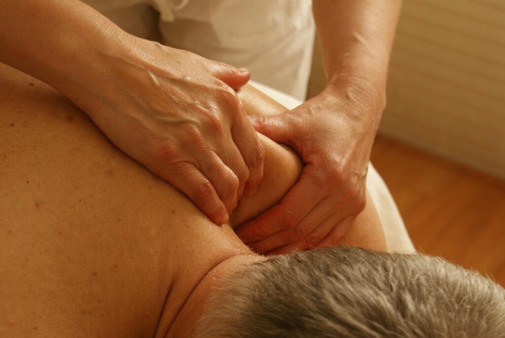 Services Close-up of a therapist giving a relaxing shoulder massage, enhancing wellness and stress relief.